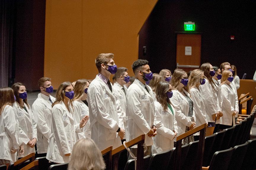 PT students standing at their White Coat Ceremony